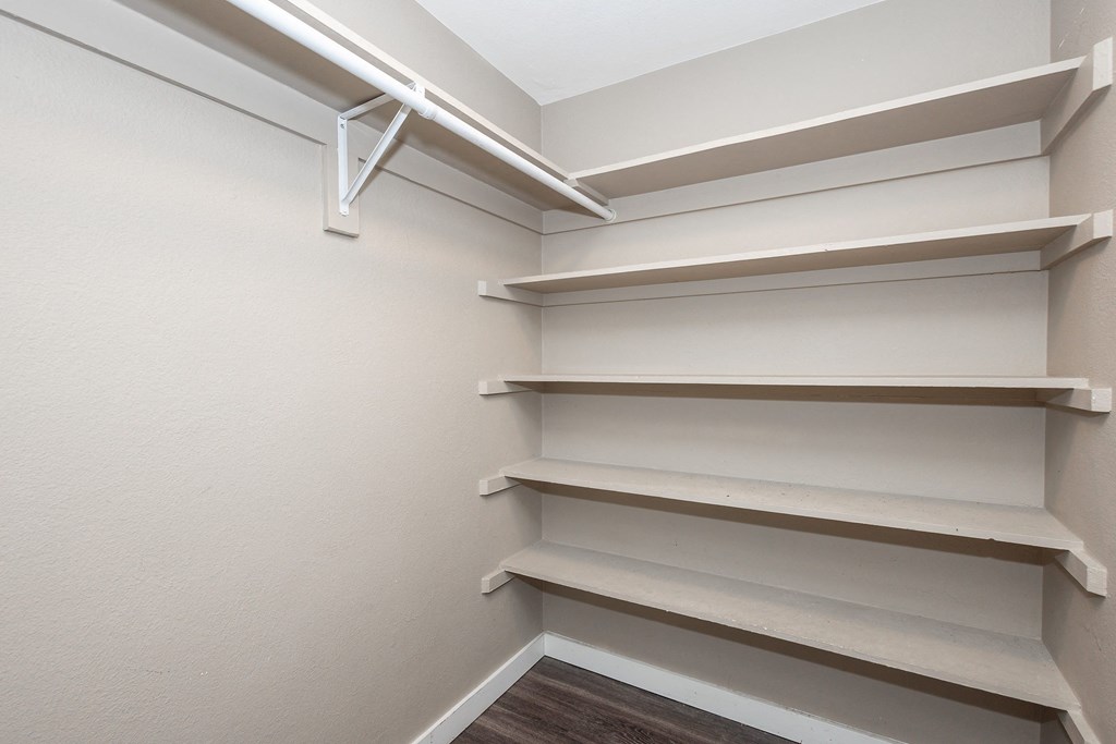Empty shelves in a white room.