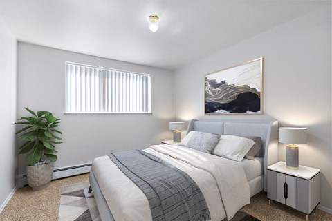 A bedroom with a bed, nightstand, and a plant.
