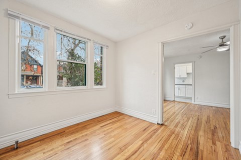A room with wooden floors and white walls.