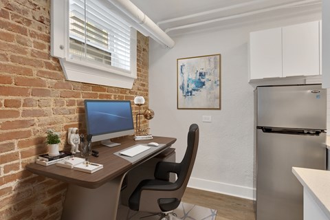 A room with a desk and a chair.