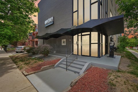 A building with a black awning and a sign that says "Bistro".