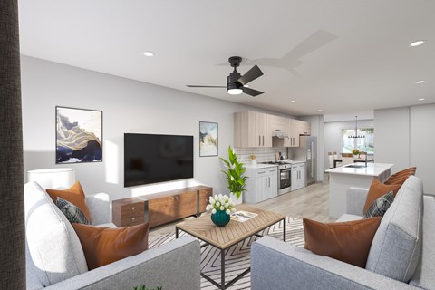 A modern living room with a grey sofa, a wooden coffee table, and a flat screen TV.