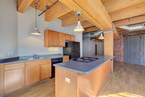 a kitchen with wooden cabinets and a blue counter top