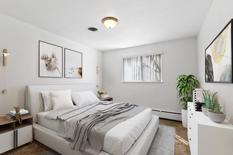 A bedroom with a large bed and a painting on the wall.