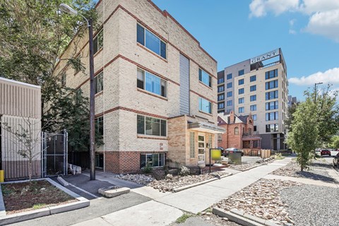A modern building with a red brick facade and a sign that reads "CRAFT".