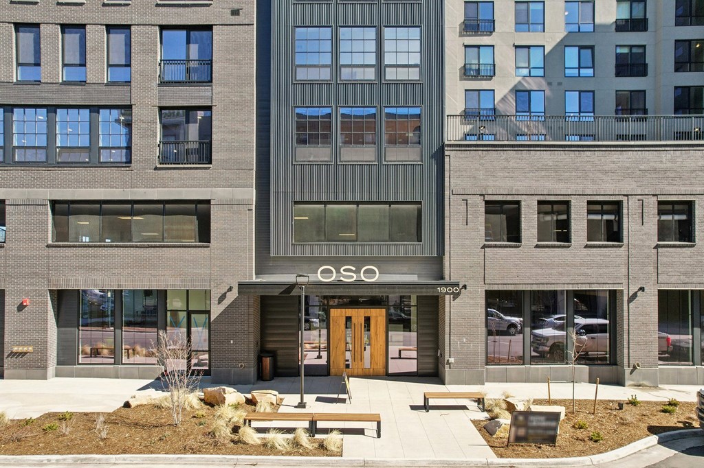 The image shows a modern building with the word "OSO" prominently displayed above the entrance.