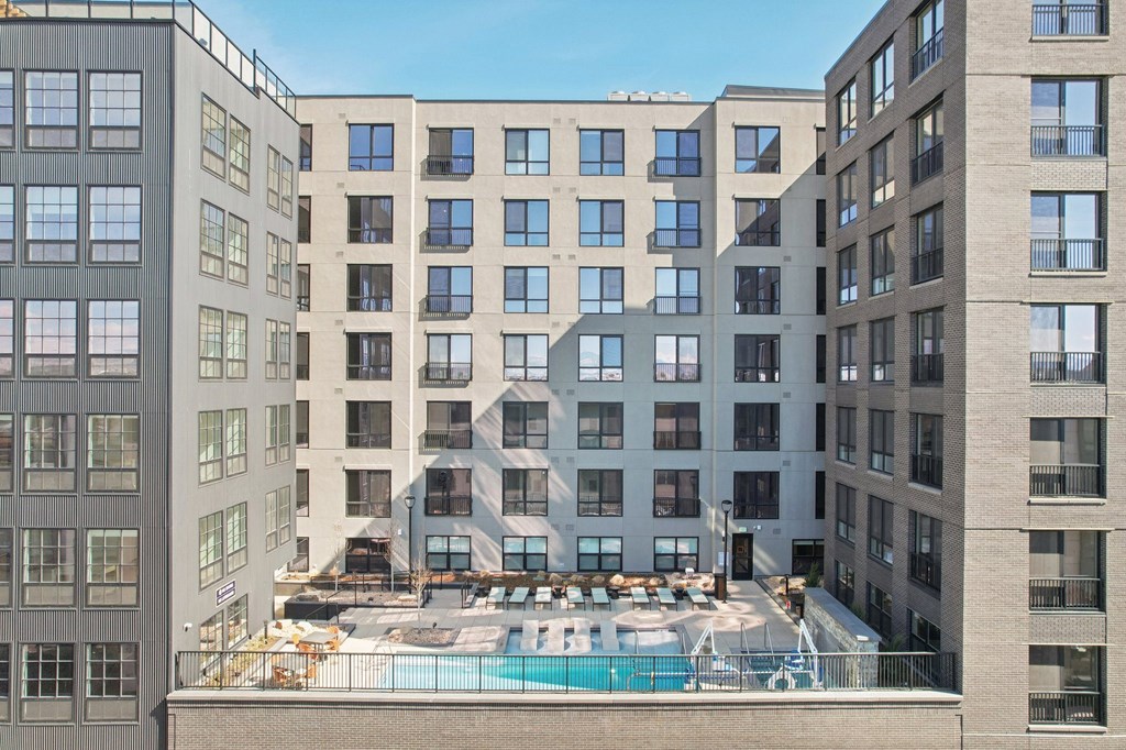 A large building with a pool in the middle of it.