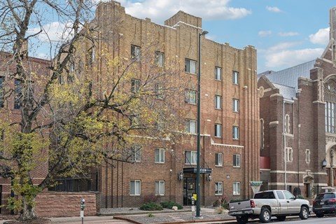 a brick apartment building on a city street
