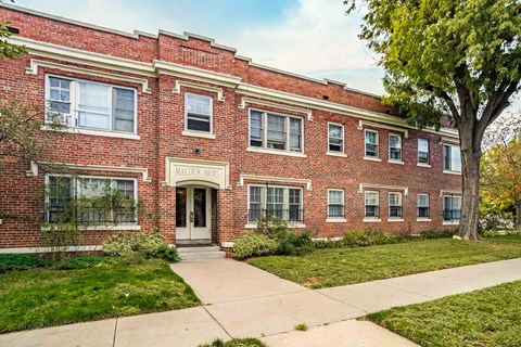 A red brick building with the words "Mallory Hall" on the front.