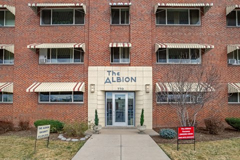 The front of a brick building with a sign that says "The Albion".