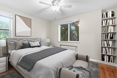 a bedroom with a large bed and a bookshelf