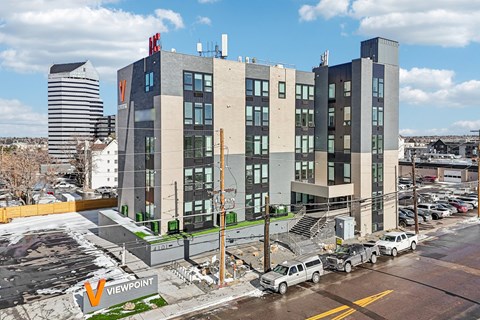 A modern building with the word "VIEWPOINT" on the ground.