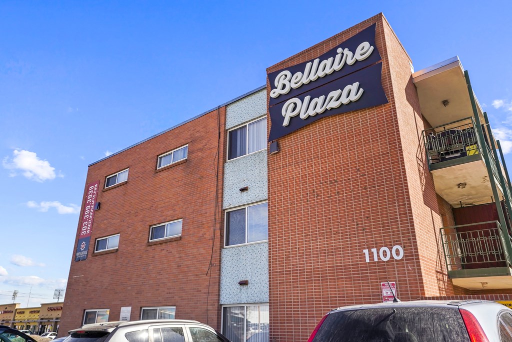 a brick building with a sign that reads pizza
