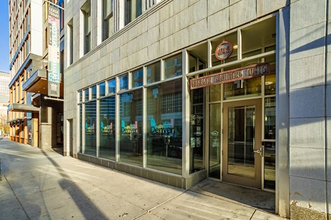 A building with a glass door and a sign that says "Denver".