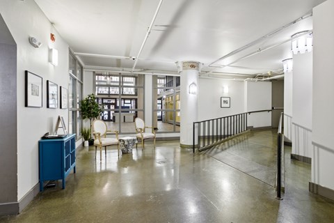 A room with a blue cabinet and a white chair.