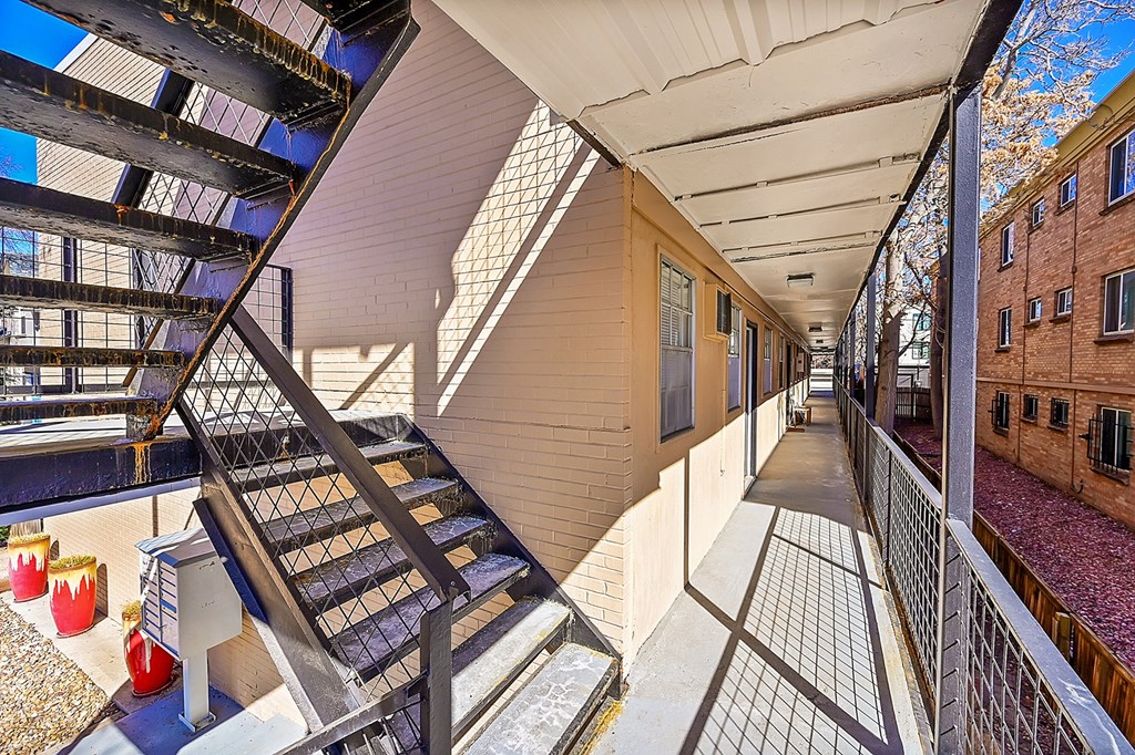 a view of the inside of a building with glass walls and stairs