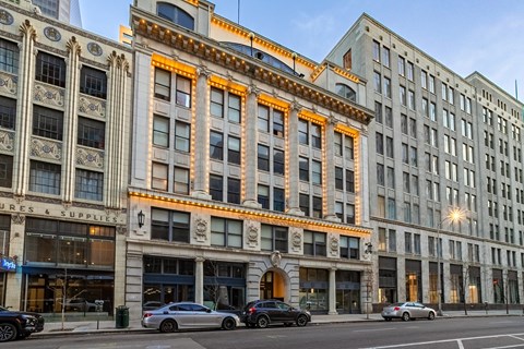 A street view of a building with the sign "Supplies & Supplies" on the ground floor.