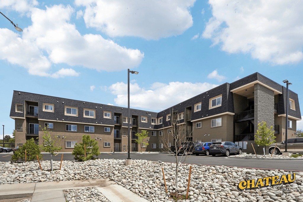 the chateau too exterior of the building with cars parked in the parking lot