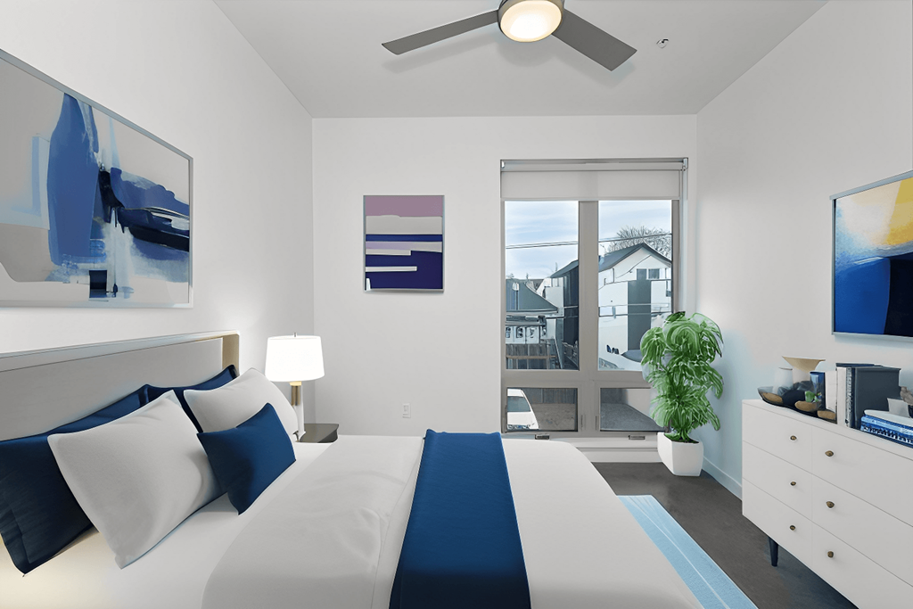 a bedroom with a bed and a ceiling fan