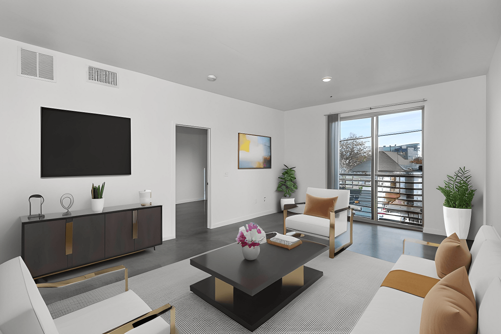 a living room with a couch and a coffee table and a television