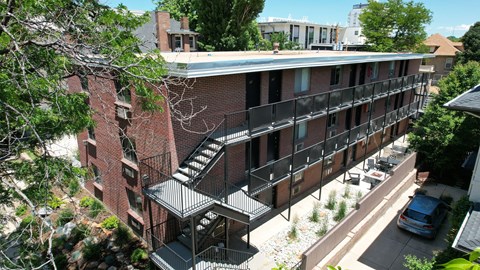 an aerial view of an apartment building with stairs