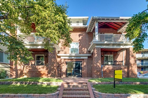 A red brick building with a sign that says "CALIFORNIA HAUS".