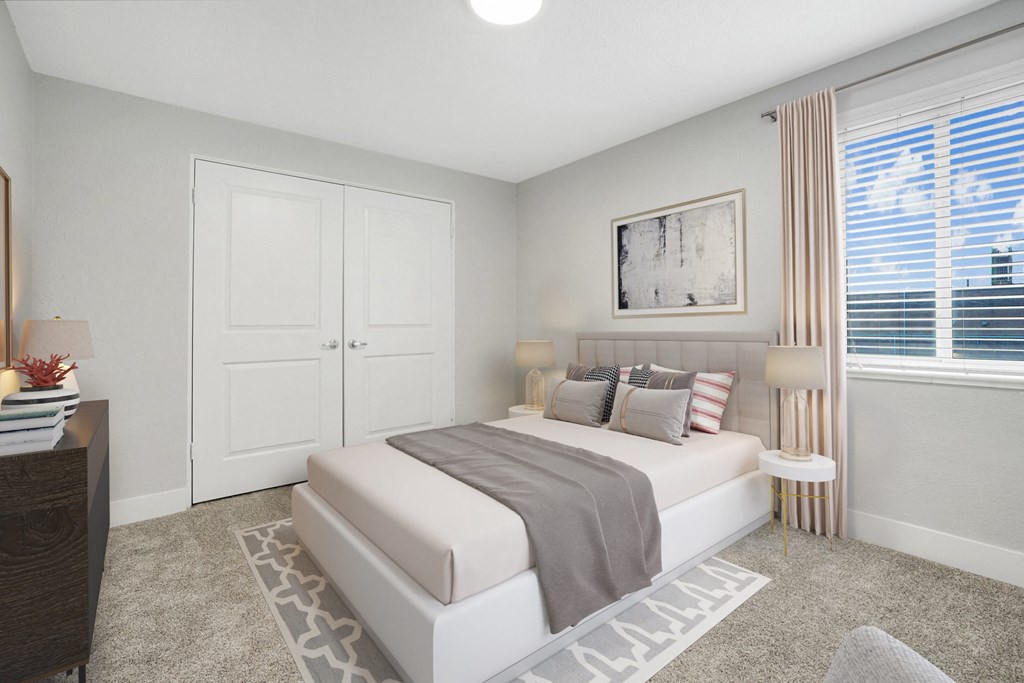 an image of a bedroom with a bed and a window