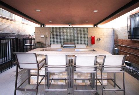 A patio with a table and chairs is shown.