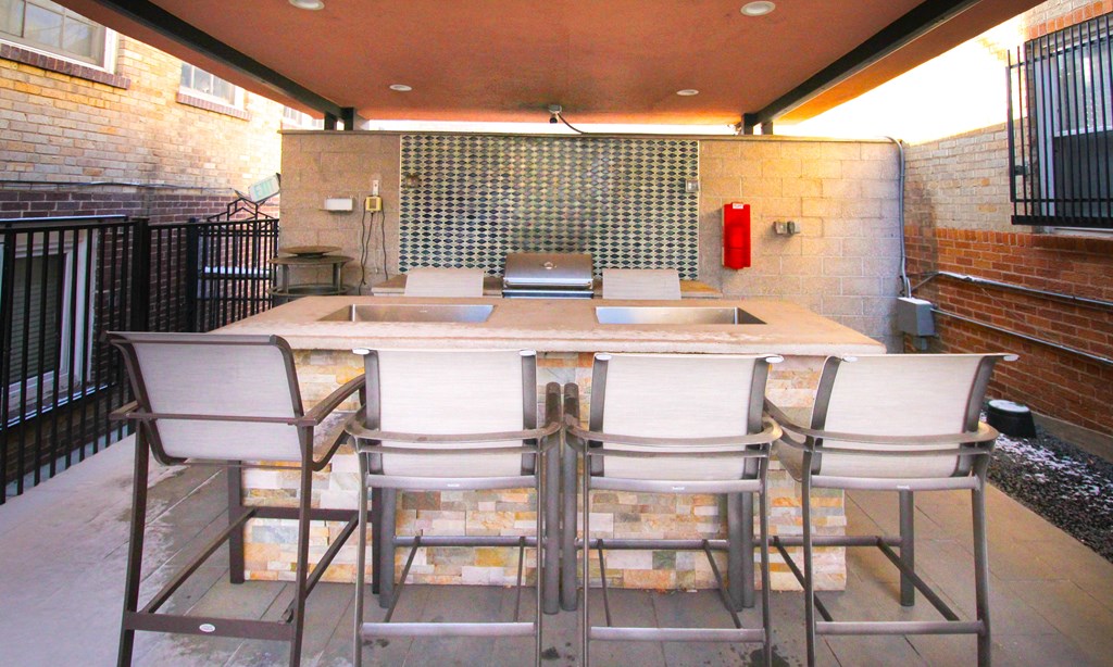 A patio with a table and chairs is shown.