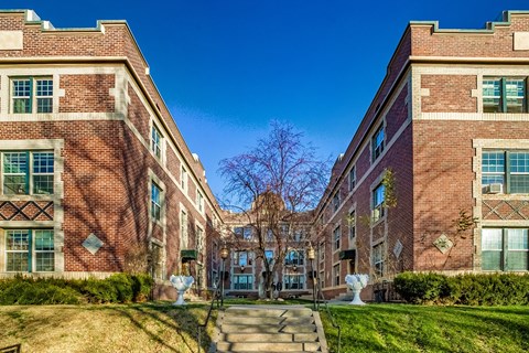 A brick building with a clear blue sky in the background.
