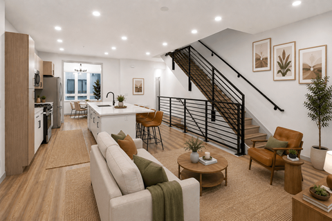 A modern living room with a staircase leading to the upper floor.