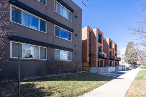 A long building with many windows and balconies.