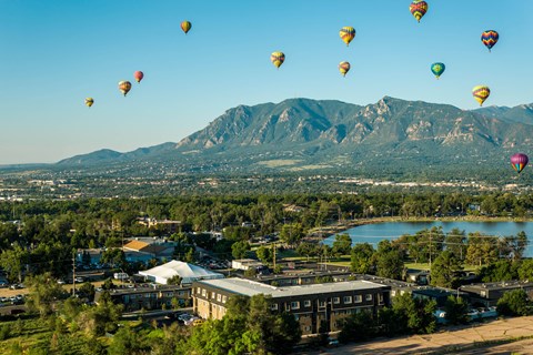 balloons over the city and mountains