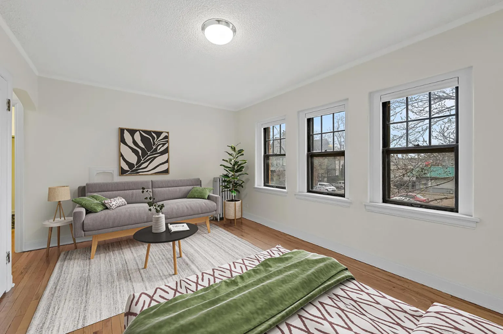 a living room with a couch and a bed