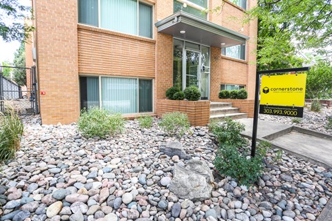 A building with a yellow sign in front of it.