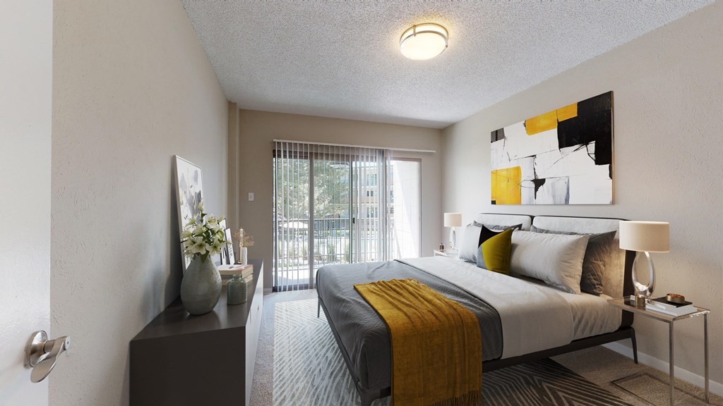 A bedroom with a bed, nightstand, and a painting on the wall.