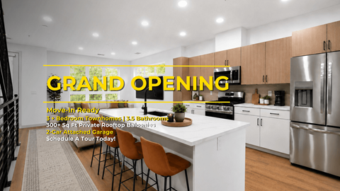 A modern kitchen with a dining table and chairs is set up for a grand opening.