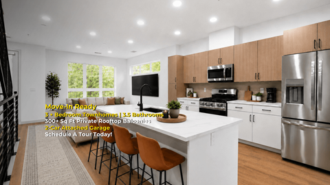 A modern kitchen with a dining table and chairs.