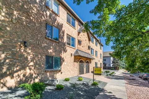 A building with a yellow sign in front of it.