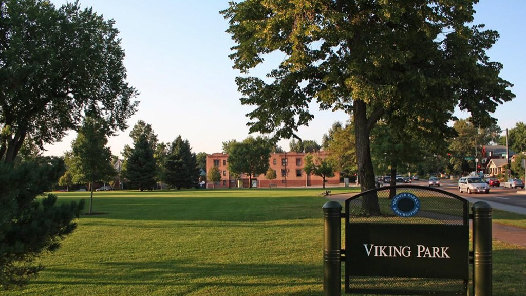 A sign in front of a tree reads Viking Park.