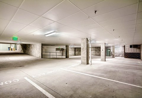 A parking garage with the word LOVE painted on the ground.