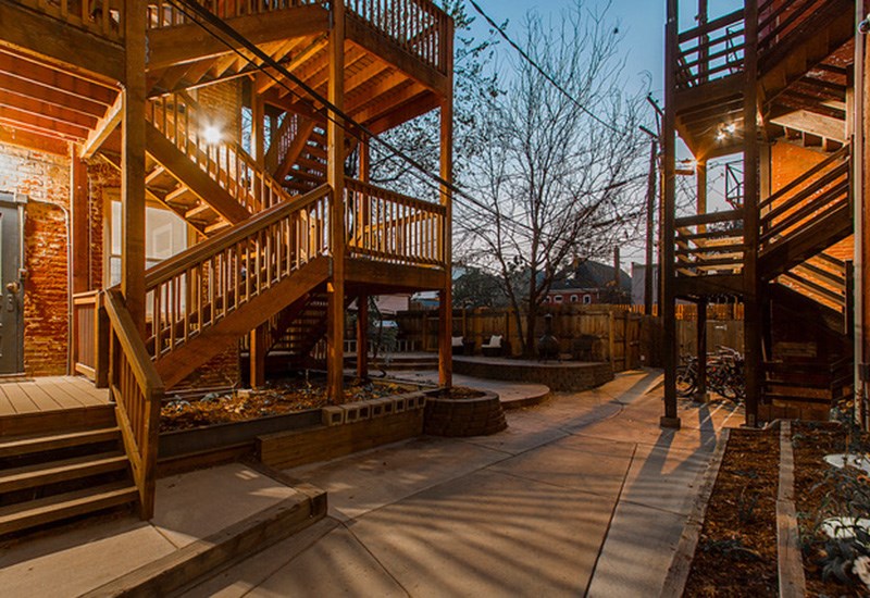 A wooden staircase with a light on it.