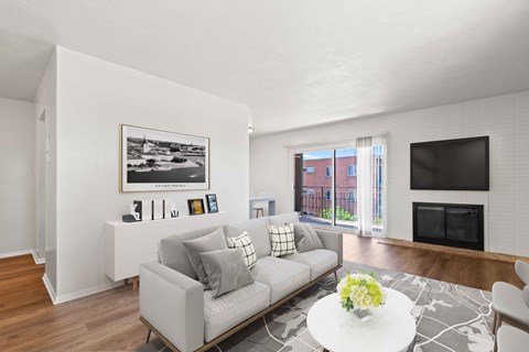 a living room with a couch and a table and a television