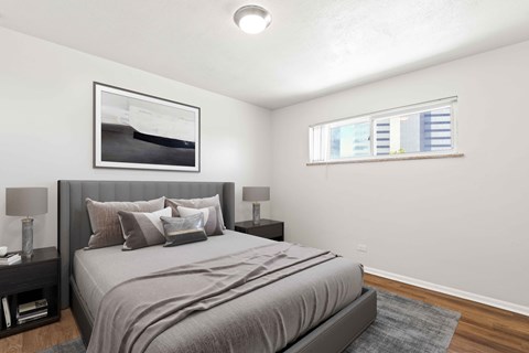 a bedroom with a large bed and a window