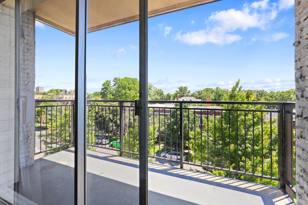 a balcony with a view of the city