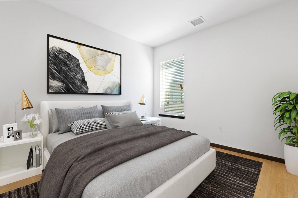 a bedroom with a large bed and a window