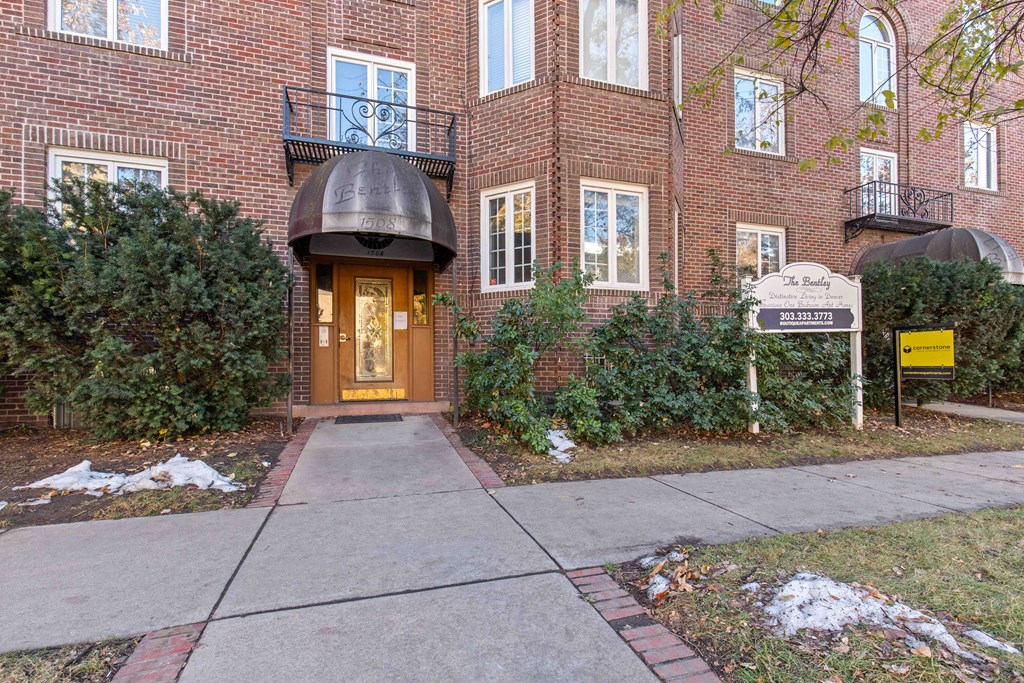 A brick building with a black awning and a sign that says "The Bounty".