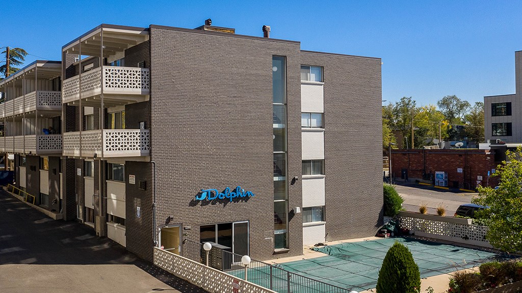 A building with a blue sign that says "Delph" on it.