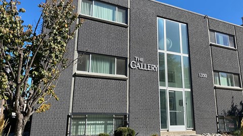 The GATEDY building is a modern structure with a large glass window.