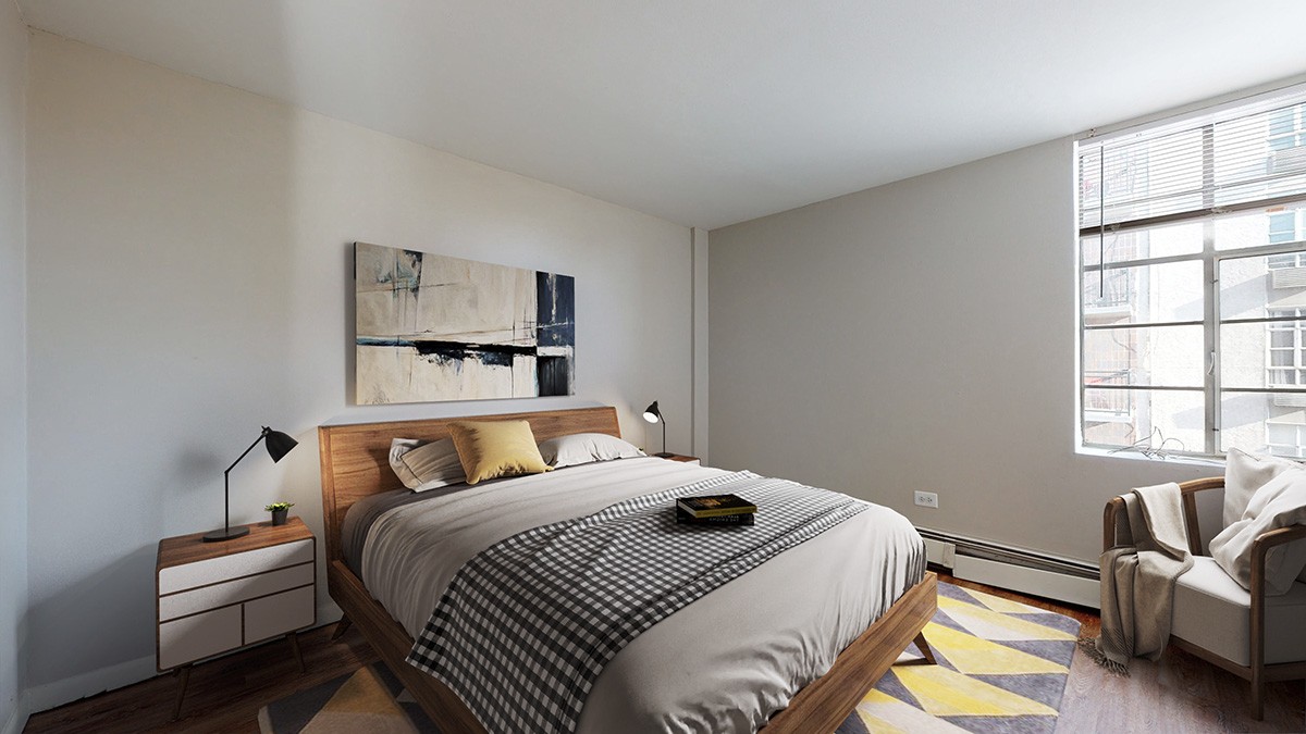 A bedroom with a bed, nightstand, and chair.